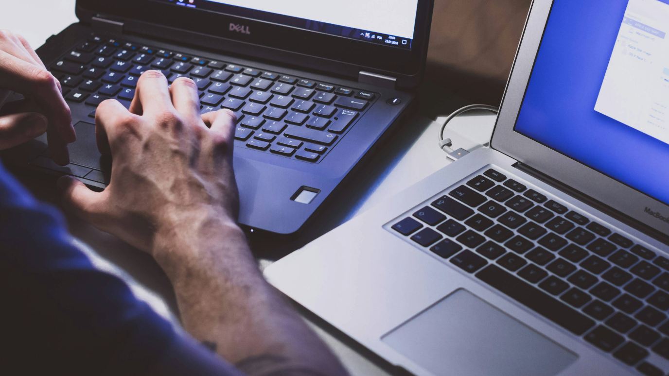 Close up of someone typing on laptop keyboards